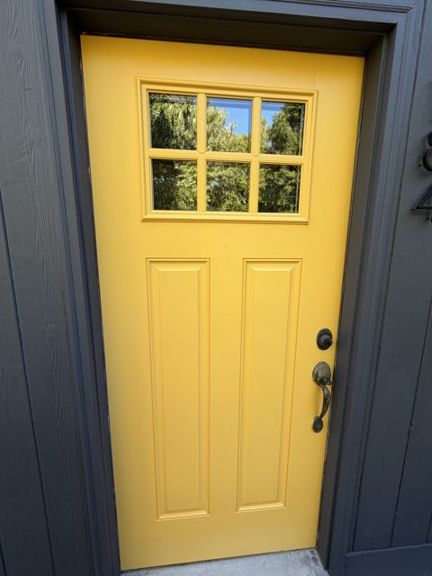 Yellow painted craftsman style door